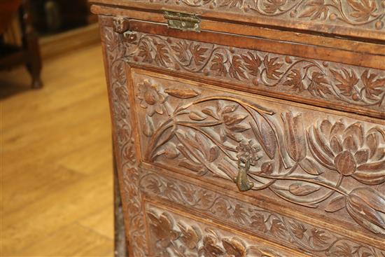 An Anglo Indian foliate carved camphorwood bureau, c.1900, W.92cm